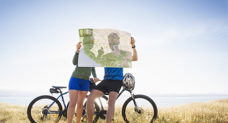 0014_187137642_20 two people with bicycles looking at a map
