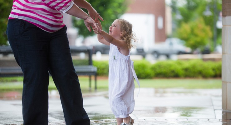 0484_471776395 woman and small child dancing on patio