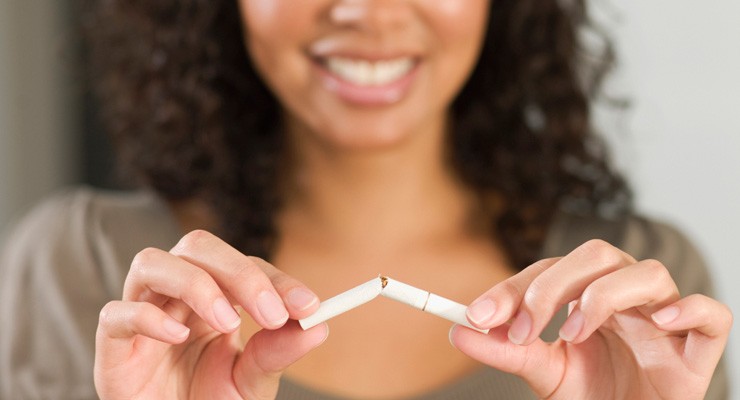 0010_81860338 image of woman breaking a cigarette