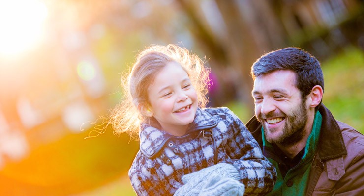 man and daughter in park