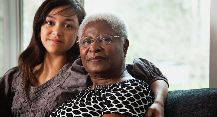 0285_123167786 caregiver sitting with her patient
