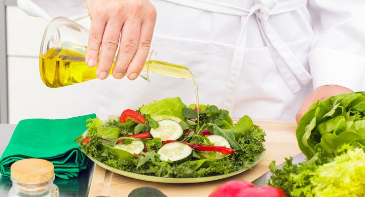 0228_171333156 delicious salad with olive oil poured on top