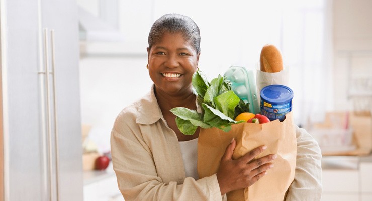 0488_71417876 image of woman with bag of groceries